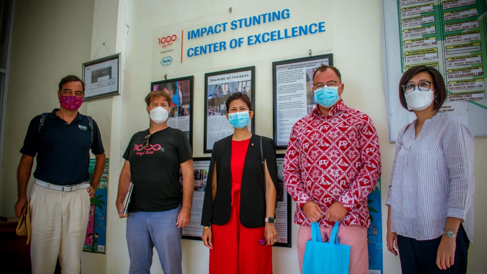 The team in front one Centre of Excellence by Roche